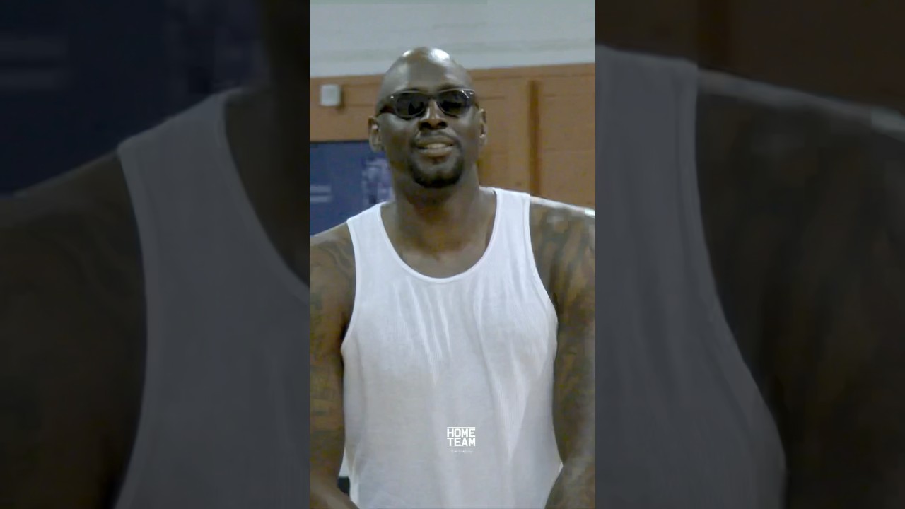 Darius Miles hoops with shades on against All Americans at the Iverson Classic
